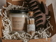 Say "Will you be my bridesmaid?" in style with this dark academia bridesmaid proposal gift box! Show your favorite bookish friends how much you appreciate their help with this thoughtful combo, featuring one Grace + Bloom literary-themed candle for them to light while they read, a decorative glass bottle of white-tipped matches, a cute claw clip to keep their hair back, and a custom-designed "Will you be my..." card that doubles as a bookmark