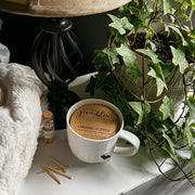 Pretty white teacup candles from Grace and Bloom Co are a beautiful addition to your cozy cottagecore decor.